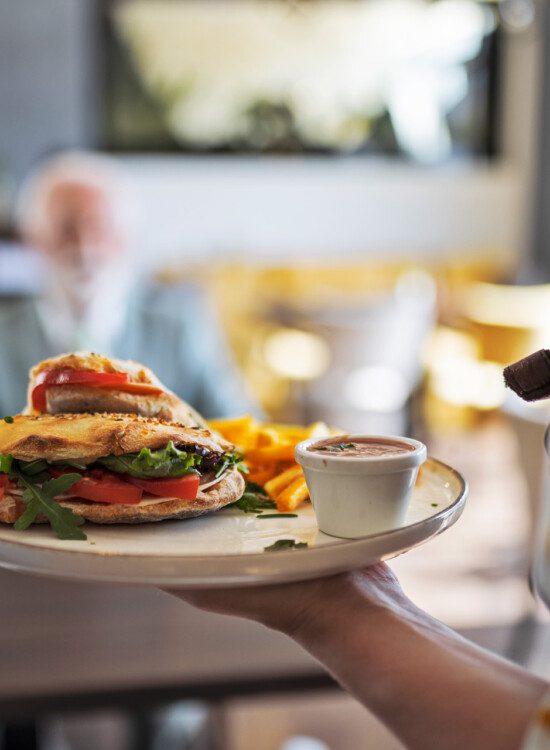 close-up of vegetable-filled omelette and breakfast platter