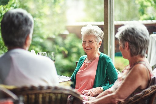 senior ladies gathered for a happy hour at their life care community