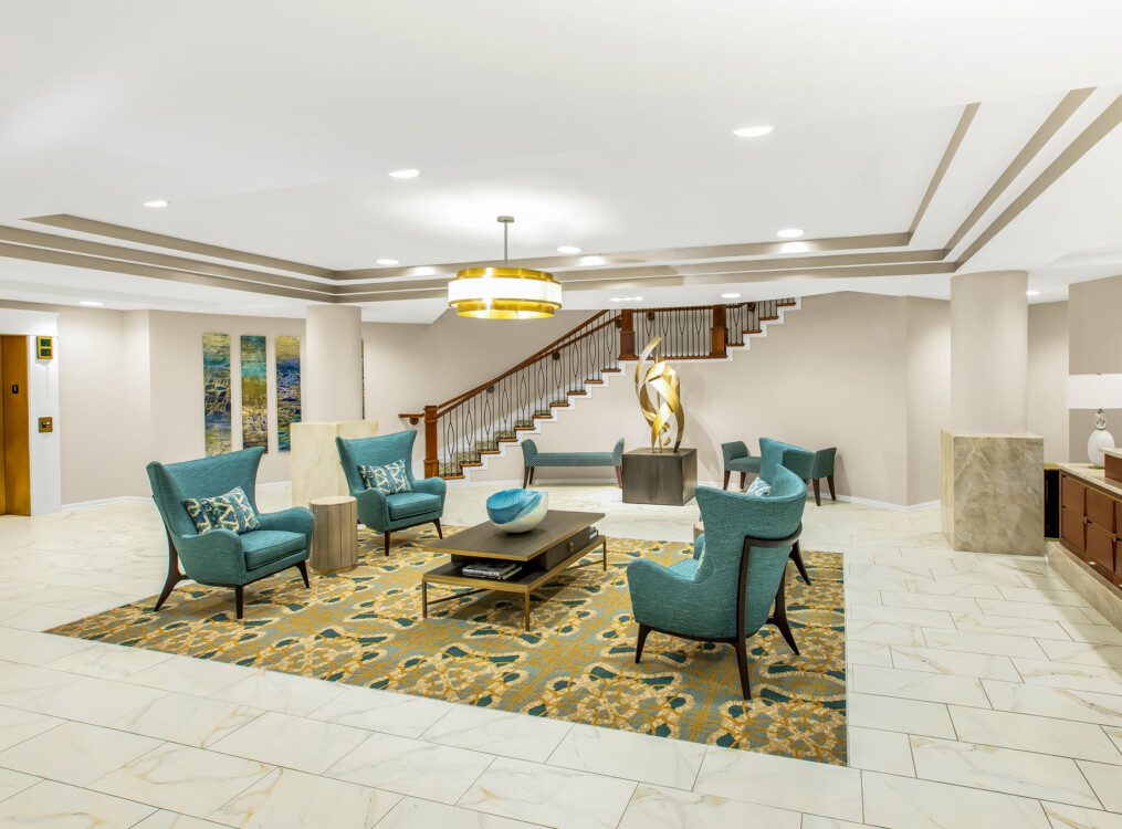 expansive lobby with seating and modern decor at Claridge Court Senior Living Community