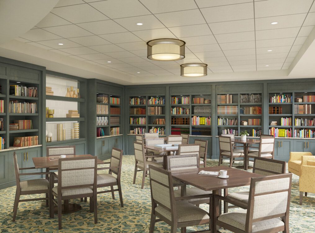 Library and lounge area with ample tables and games at Claridge Court Senior Living Community